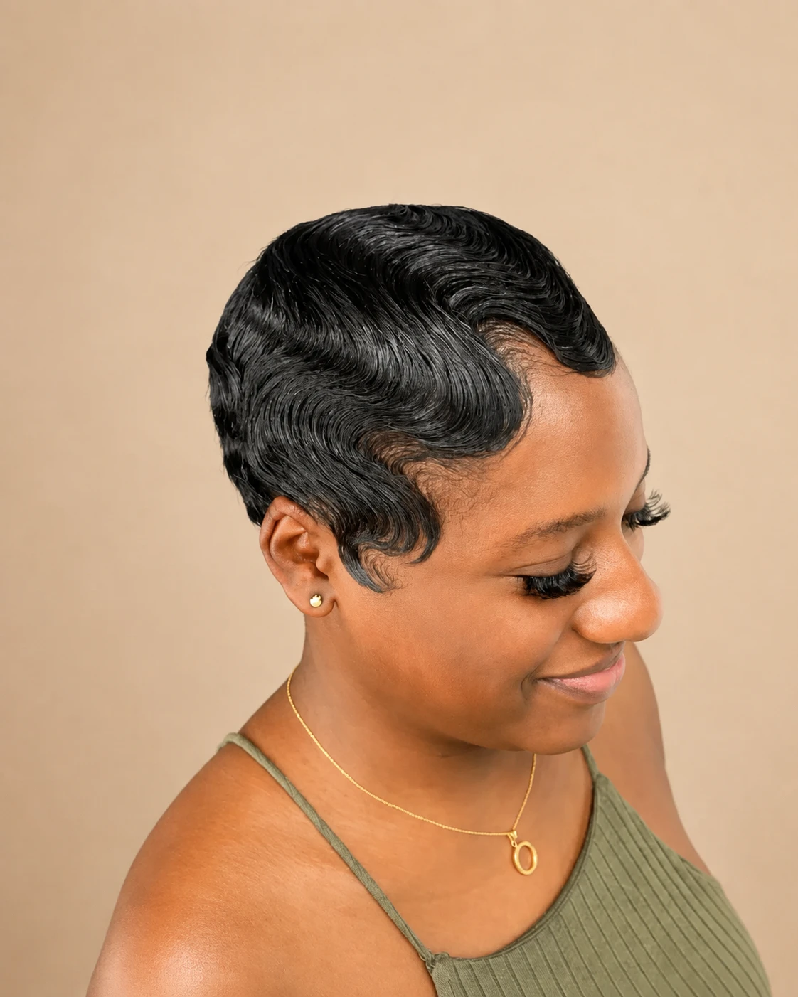 Client’s short hairstyle with glossy, sculpted finger waves